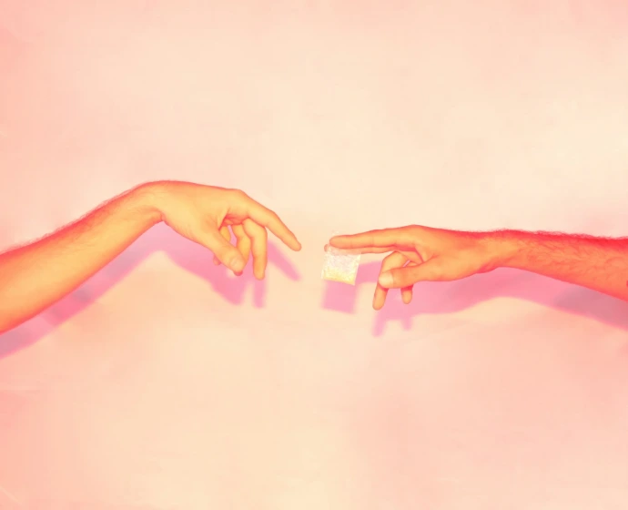 two hands reaching out towards each other